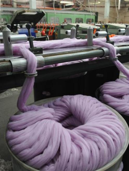 A "sliver" of wool from a carding machine is combed to remove short fibres and vegetable matter...