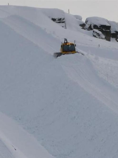 A snow-groomer is used to form the Cardrona halfpipe this week. Photo by Hamish Rudhall.