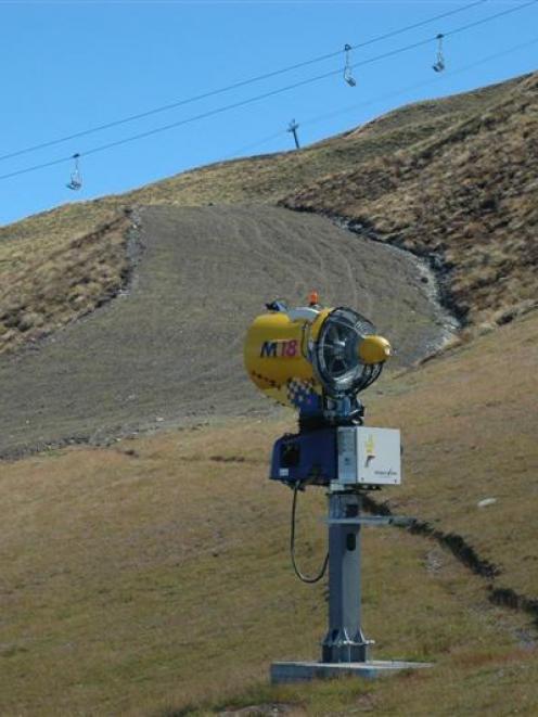 A snow gun stands near the base of the new novice trail at Coronet Peak.