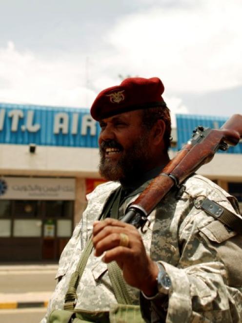 A soldier stands outside Sanaa International Airport in Yemen. REUTERS/Khaled Abdullah