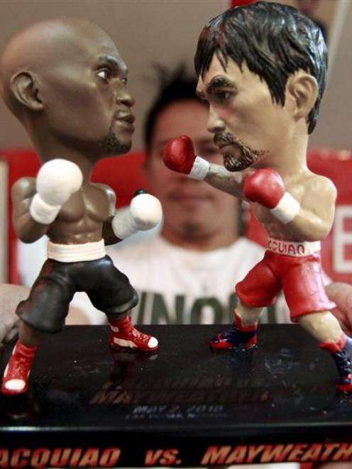 A statuette featuring miniature figurines of boxers Floyd Mayweather jun (left), of the United...