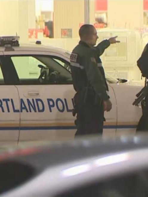 A still image taken from video courtesy of KATU-TV shows Portland police officers responding to a...