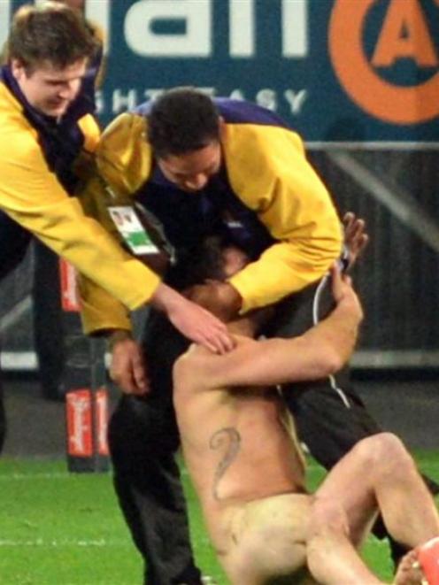 A Streaker during the 2014 Allblack and England rugby Test at the Forsyth Barr Stadium on...