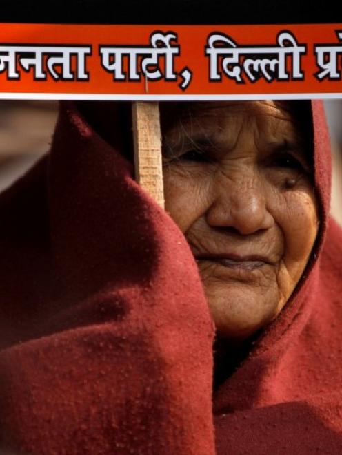 A supporter of India's main opposition Bharatiya Janata Party (BJP) attends a demonstration in...