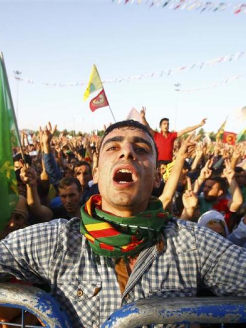 A supporter of the Pro Kurdish Peoples' Democratic Party  cheers during a gathering last week in...