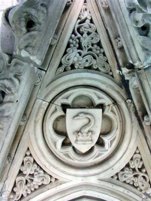 A swan's neck rises from a crown (both elements of the Swire  family crest)  on the Cargill...