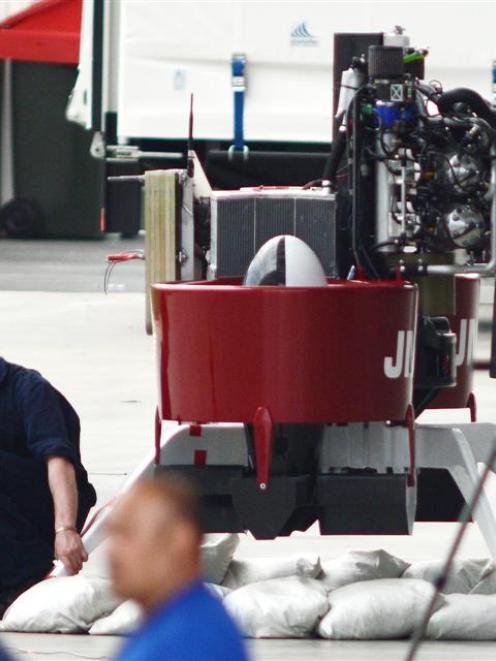 A technician works on the Martin Jetpack P12.3 at Forsyth Barr Stadium, in Dunedin, yesterday....