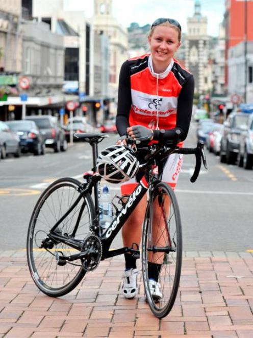 A tired Irene Le Fleming (19), of Waimate, leans on her bike in Dunedin's Octagon yesterday,...