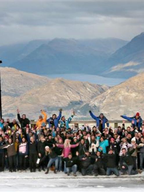 A total of 240 staff take time out from preparing for the 2011 ski season   to pose for a photo...