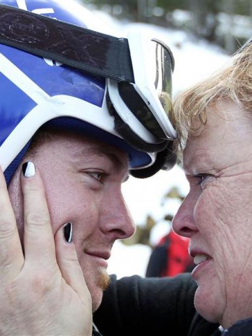 A triumphant Adam Hall is congratulated by his mother Gayle.
