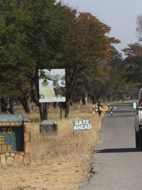 A vehicle carries visitors arriving at Zimbabwe's Hwange National Park. REUTERS/Philimon Bulawayo