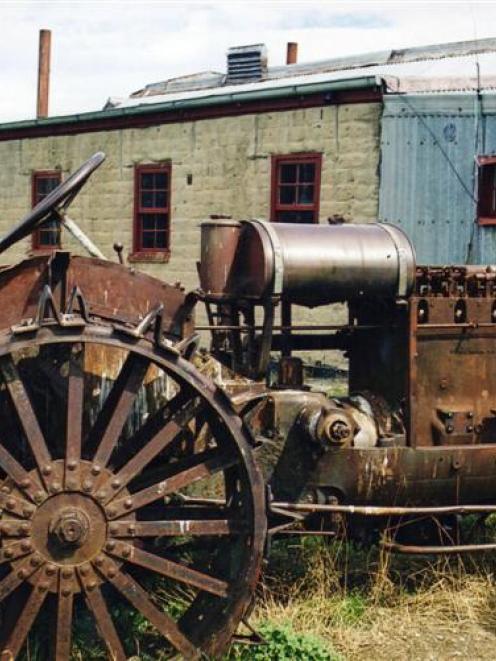 A vintage McCormick Deering tractor outside Hayes Engineering Works at Oturehua, where several...