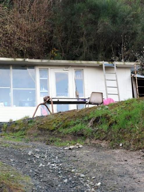A workers' hut neighbours say has been built illegally as part of a defacto builders' yard on...