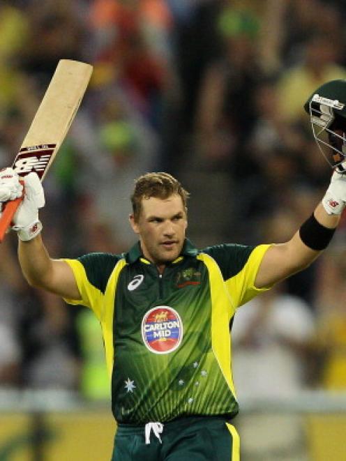 Aaron Finch celebrates reaching his century. Photo Getty Images