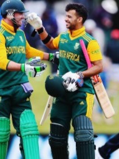 AB de Villiers and Jean-Paul Duminy of South Africa celebrate after winning the One Day...