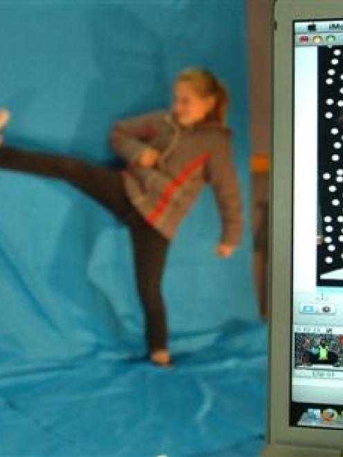 Abby-Rose Evans (left) and Katie Duncan (of St Marys School, Mosgiel) do battle with Bob the...