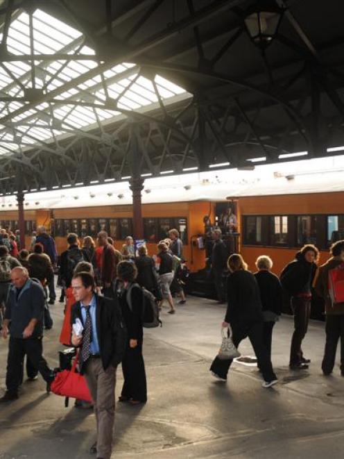 About 200 people get off a commuter train from Waitati at Dunedin Railway Station yesterday as...