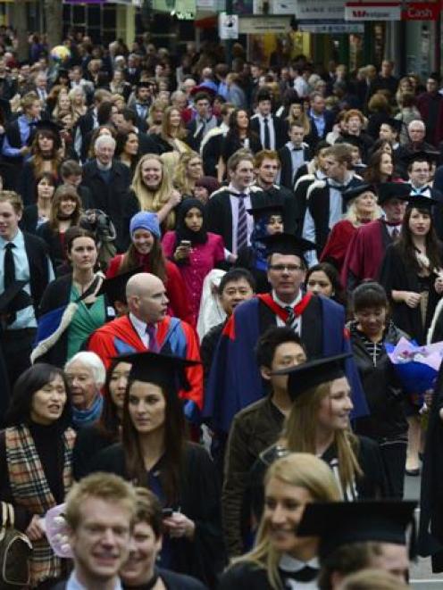 About 340 graduands  in all disciplines from the University of Otago parade along George St, in...