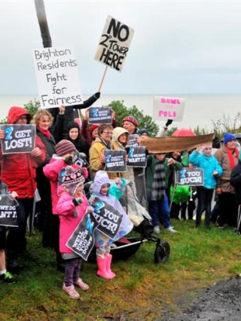About 60 Brighton residents brave the cold yesterday afternoon to show their opposition to...
