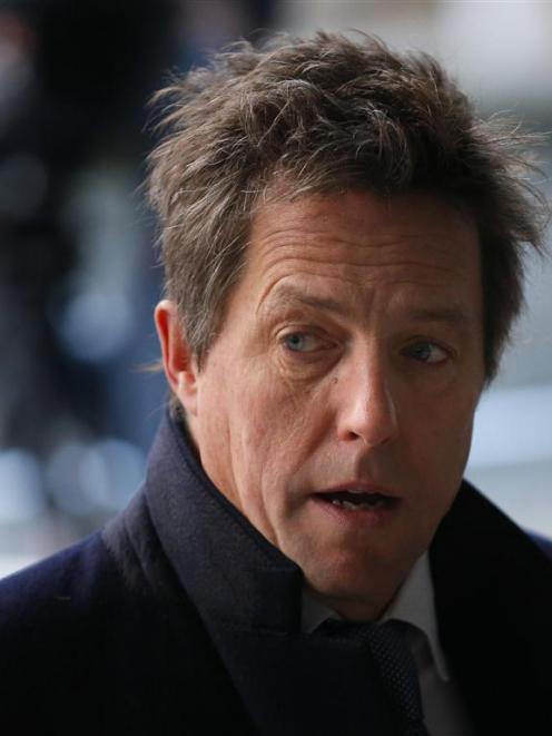 Actor Hugh Grant will donate his damages to pressure group 'Hacked Off'.   REUTERS/Andrew Winning