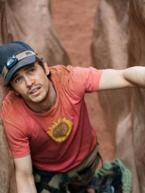 Actor James Franco performs in a scene for the movie <i>127 Hours</i>. Photos by MCT.