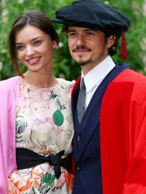 Actor Orlando Bloom, with his girlfriend Miranda Kerr, pose for the cameras before he received an...