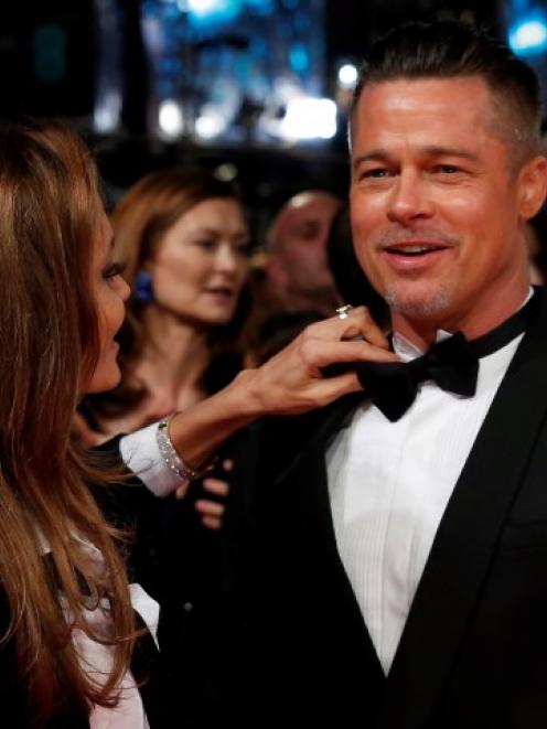 Actors Brad Pitt and Angelina Jolie arrive at the Baftas ceremony at the Royal Opera House in...