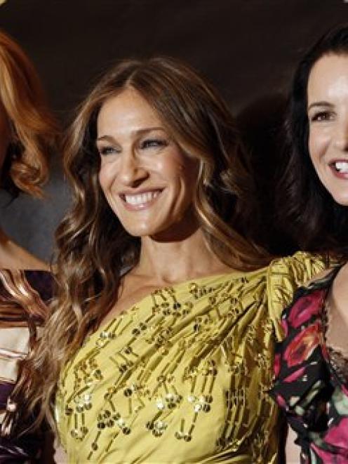 Actresses Sarah Jessica Parker, center, Cynthia Nixon, left, and Kristin Davis, from the upcoming...