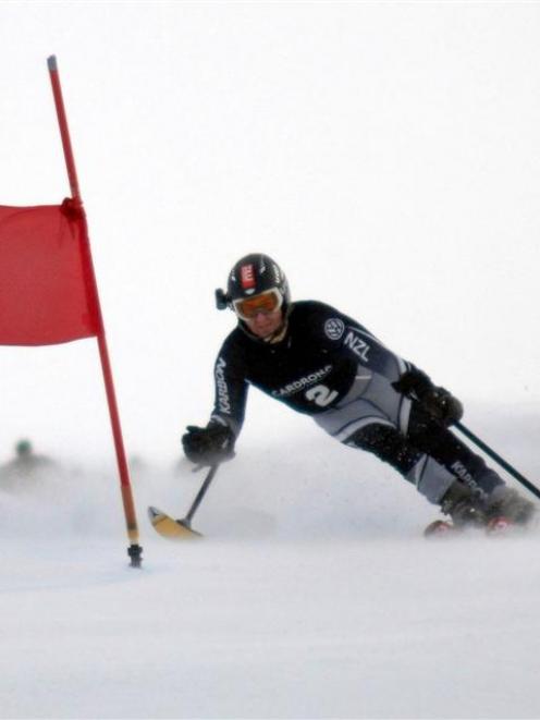 Adam Hall, of New Zealand, competes in the standing men's adaptive LW1 giant slalom at Coronet...
