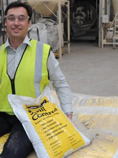 Adveco general manager New Zealand Andrew Protheroe with a lump of raw material and some bagged...