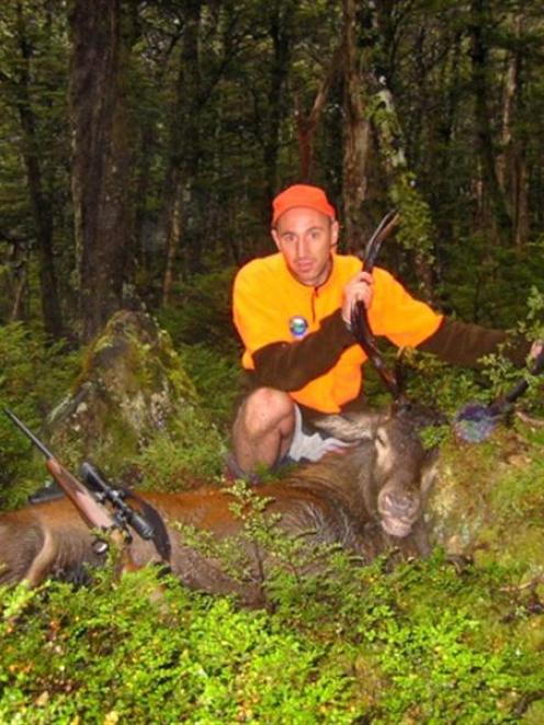 Hunter Safety Lab Ltd founder and chief executive Michael Scott with a deer in the Nelson Lakes,...