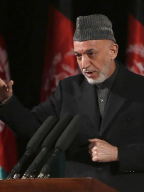 Afghan President Hamid Karzai gives a speech during an event to mark International Women's Day in...
