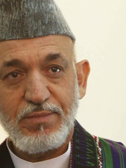 Afghan President Hamid Karzai, who labelled as 'inhuman' the actions of two US Marines who were...