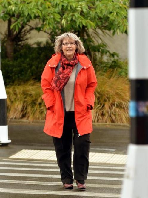 Age Concern Otago executive officer Susan Davidson uses a pedestrian crossing in Dunedin...