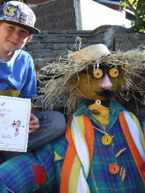 Aiden Gordon and his nana Sue Parker pose beside Aiden's winning scarecrow. Photo by Christina...