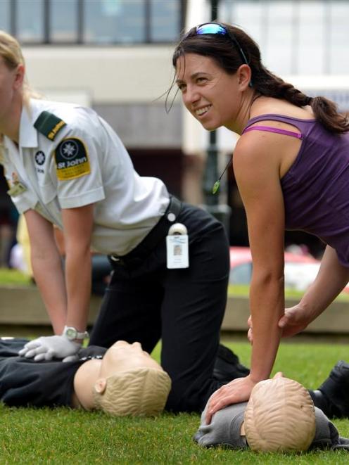 Aimee Morison, of St John (left), shows Wanaka resident Emma Davies how to perform CPR in Dunedin...