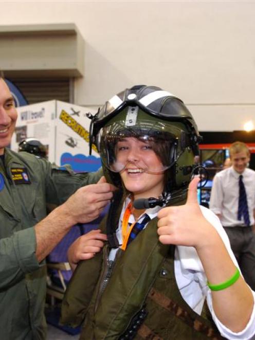 Air Force recruiter Sergeant Mike Ivamy kits out St Kevins College pupil Lizzie Talaska (16) in...