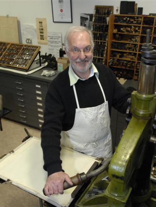 Alan Loney uses an Albion handpress during his time as printer in residence at the University of...