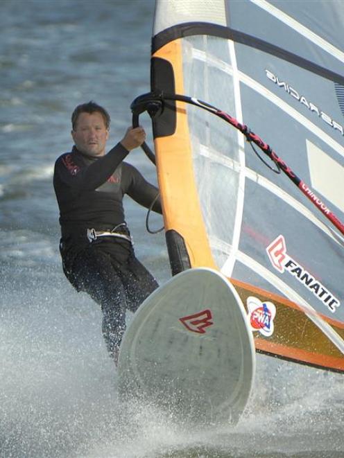 Alan Taylor, of Dunedin, controls his windsurfer on Otago Harbour at the national windsurfing...