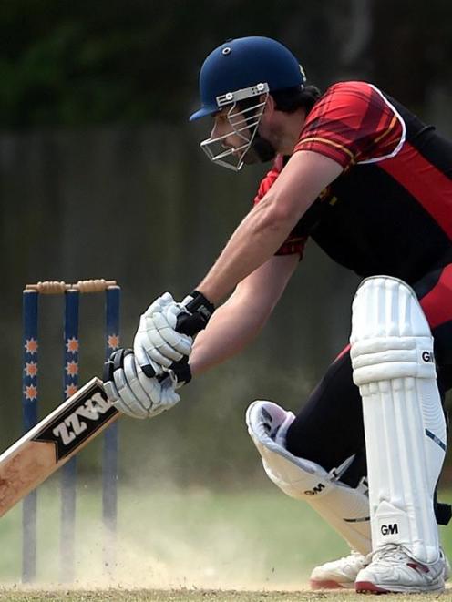 Albion batsman Michael Snedden keeps the ball out against Green Island at Tonga Park on Saturday....