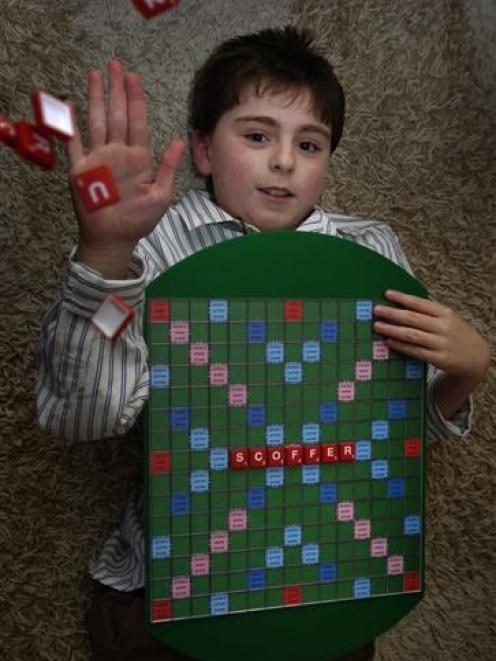 Alex Leckie-Zaharic, of Dunedin, shows off the word which won him the highest score in an award...