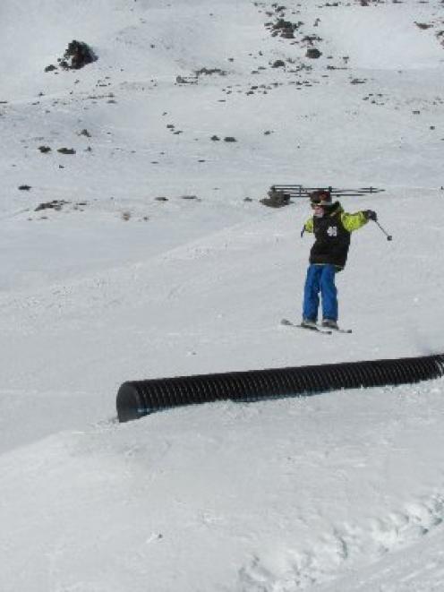 Alex Young, of Wanaka, takes flight while competing in the 12 Under Ski Male category, during the...