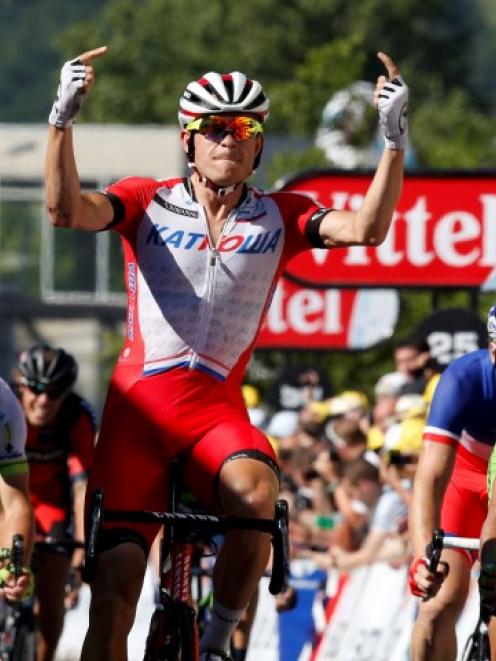 Alexander Kristoff reacts as he wins the 185.5km 12th stage of the Tour de France between Bourg...