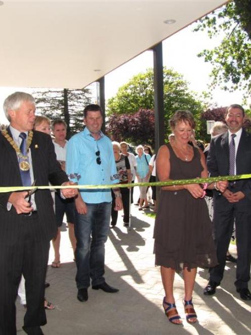 Alexandra Community House trust chairwoman Bernie Lepper and Central Otago Mayor Tony Lepper cut...