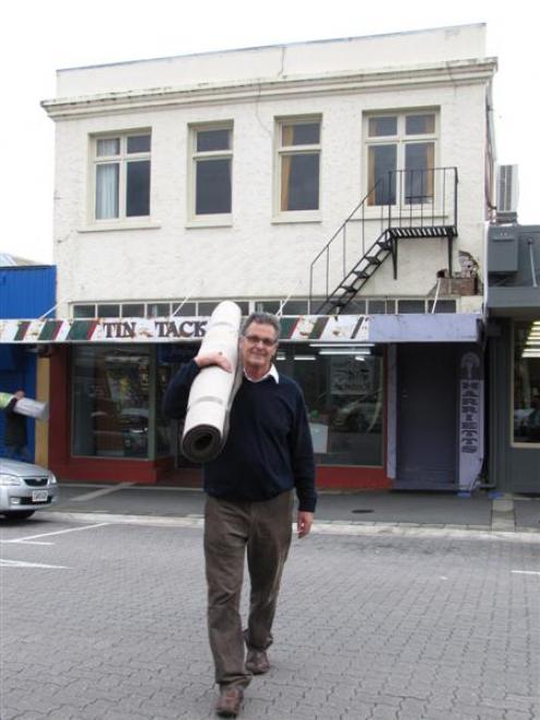 Alexandra Floor Pride manager Trevor Mills moves stock to his new shop to make way for demolition...