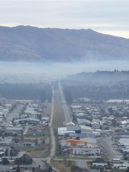 Alexandra under a veil of smoke after bonfires boosted air pollution on a still day last week....