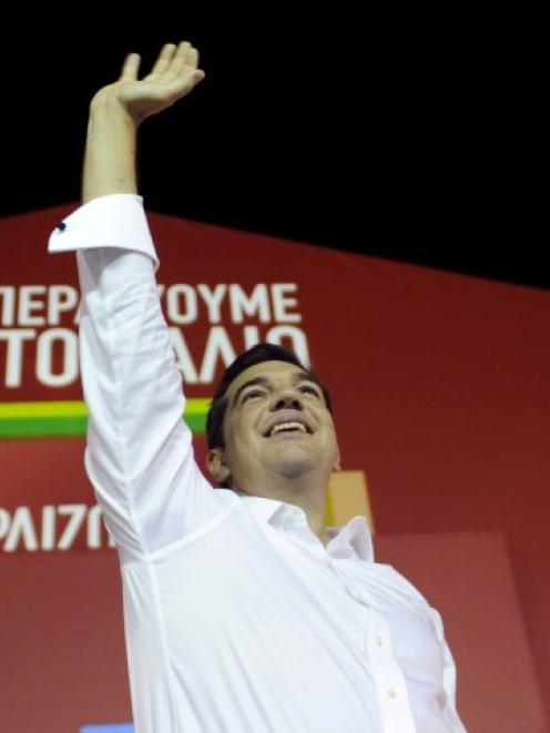 Alexis Tsipras waves to supporters in Athens after winning the general election.  REUTERS...