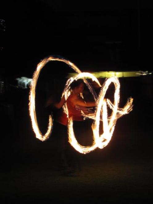 Alison Davis, of Canada, fire-dances at Earnslaw Park on Saturday night during Earth Hour 2010....