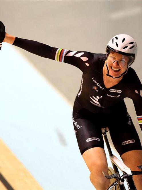 Alison Shanks celebrates her win in the women's individual pursuit. (Photo by Mark Dadswell/Getty...