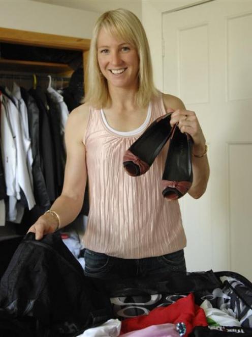 Alison Shanks unpacks. Photo by Linda Robertson.